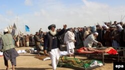 Relatives participate in the funeral of Afghan civilians reportedly killed in a NATO operation in November, 2015.