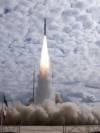 This handout photo provided by Iran's Revolutionary Guards Corps (IRGC) shows the launch of the Qaem-100 satellite launch vehicle. 