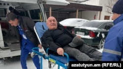 Armenia - Former Gyumri Mayor Vartan Ghukasian's bodyguard is taken to hospital from a police station in Gyumri, February 20, 2025.