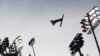 Belarus's Dmitri Dashinski practices his routine ahead of the Men's Freestyle Skiing Aerials qualification. - Photo by Adrian Dennis for AFP