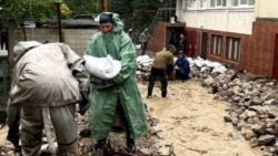 Personnel from the Crimean main directorate of the Russian Emergencies Ministry are at work in Koreiz during a flood caused by a storm in October 2026.
