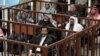 Hussein Lawyers Walk Out As Trial Resumes