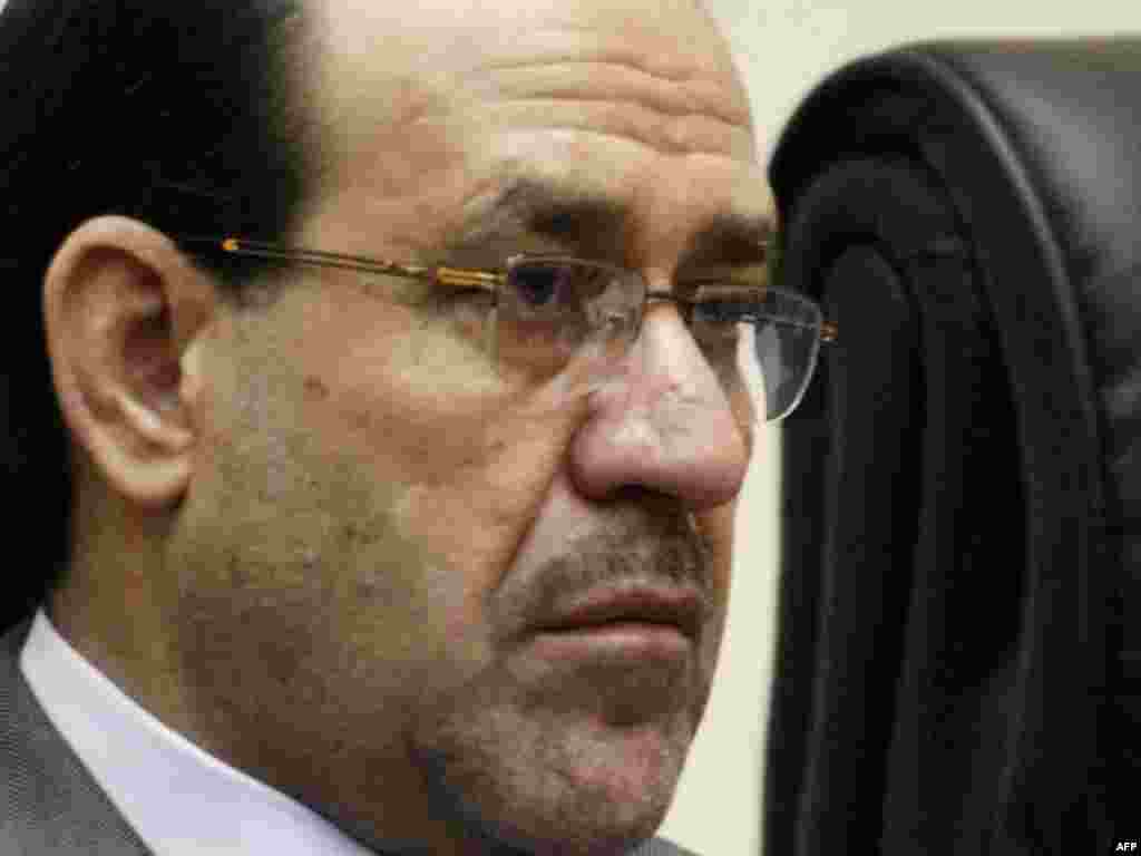 Iraq -- Prime Minister Nuri al-Maliki attends a meeting with representatives of donor states to discuss the strategy for ridding Iraq from landmines and explosive remnants of the war at the government offices in Baghdad, 25Oct2010 - IRAQ, Baghdad : Iraqi Prime Minister Nuri al-Maliki attends a meeting with representatives of donor states to discuss the strategy for ridding Iraq from landmines and explosive remnants of the war at the government offices in the Iraqi capital Baghdad on October 25, 2010. AFP PHOTO/SABAH ARAR 