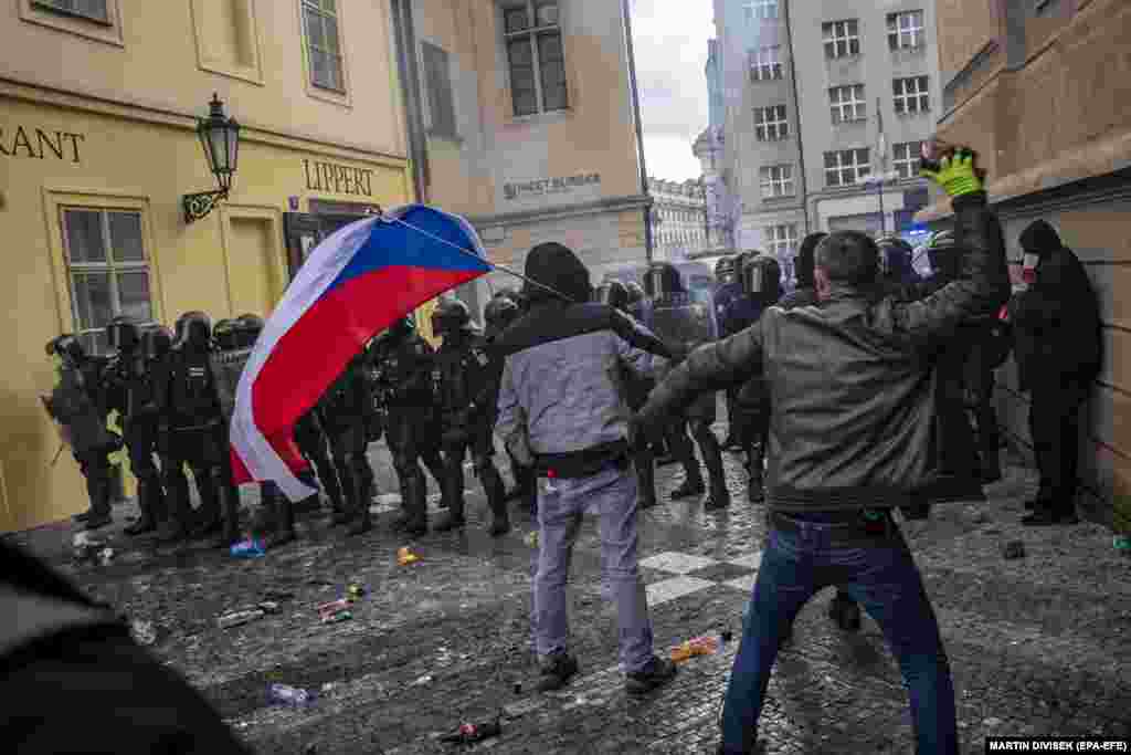 Demonstrators protest against the Czech government's new measures in connection with the COVID-19 pandemic caused by the SARS-CoV-2 coronavirus, at the Old Town Square in Prague, October 18, 2020. 