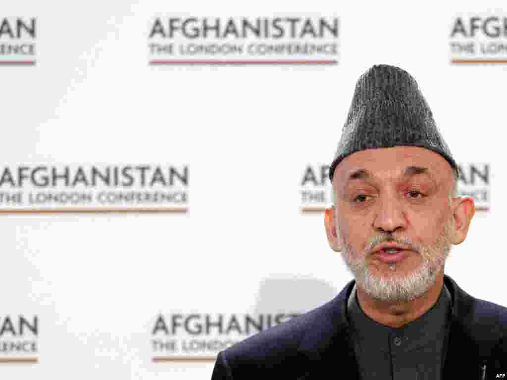 UNITED KINGDOM, London : Afghan President Hamid Karzai makes a speech during the Opening Session of the 