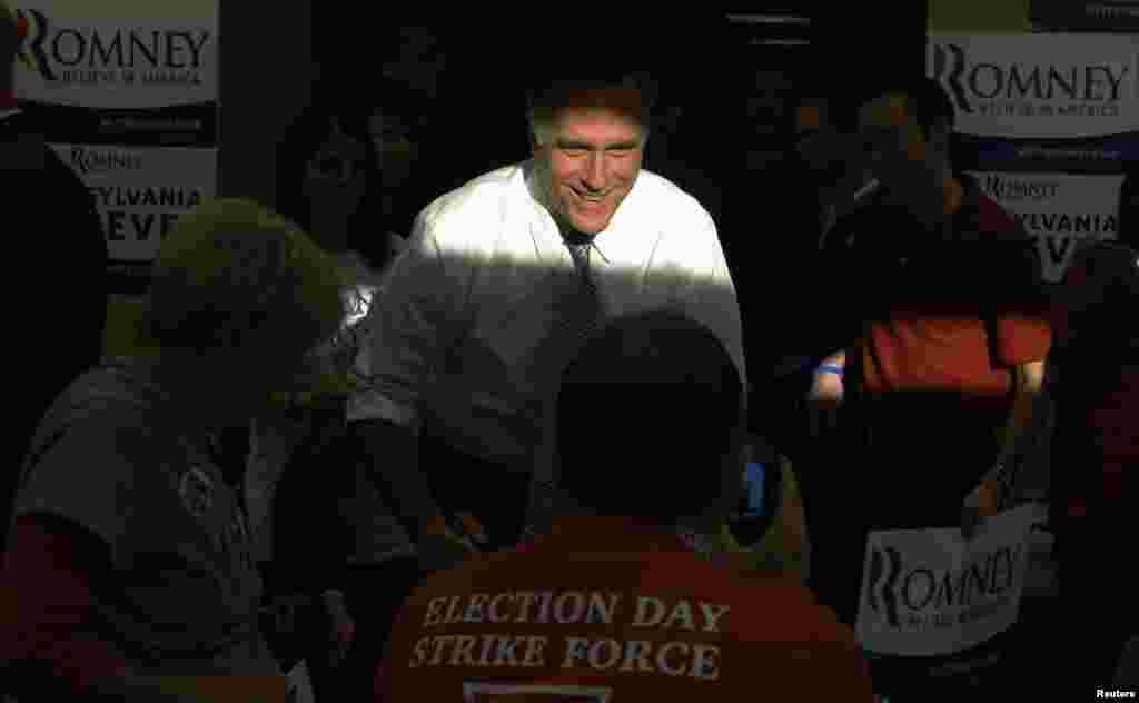 Mitt Romney greets workers at a campaign call center in Green Tree, Pennsylvania.