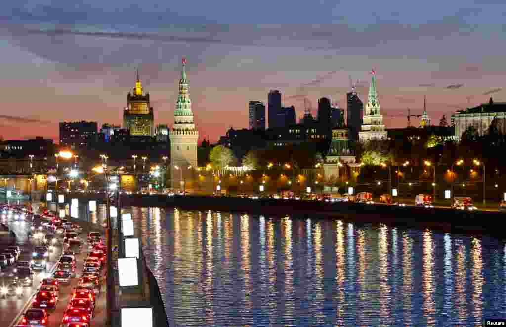Moscow's Kremlin and Foreign Ministry is seen with the Moscow City business district in the background.