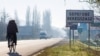 Inscriptions in two languages, Ukrainian and Hungarian, are seen on a road sign of Berehove, a small town in western Ukraine.