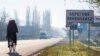 Inscriptions in two languages, Ukrainian and Hungarian, are seen on a road sign in Berehove, a small town in western Ukraine.