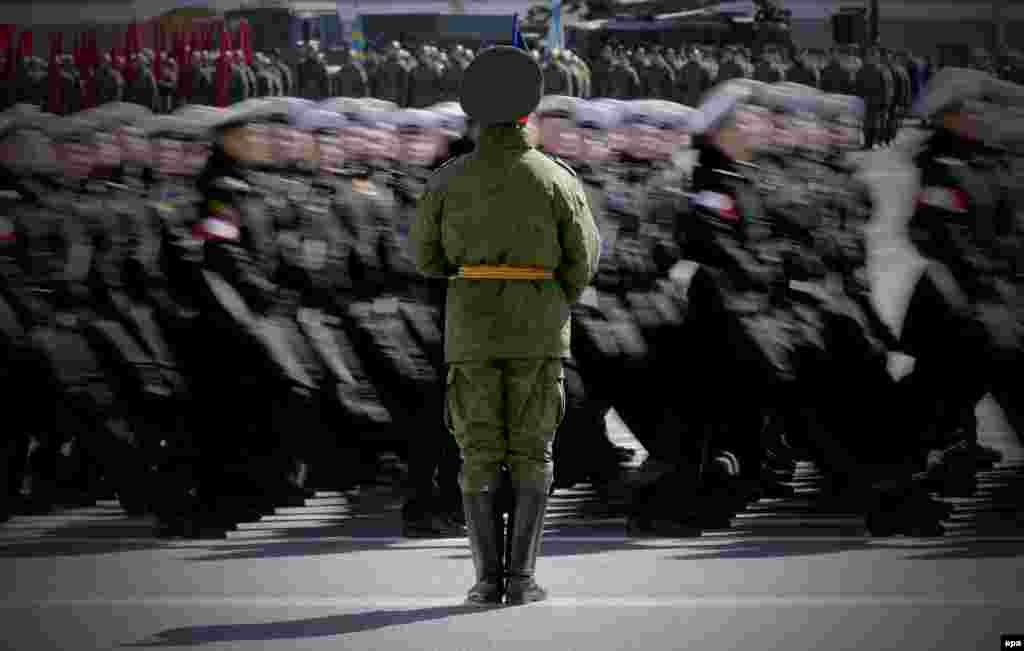 Russian Navy personnel march on Dvortsovaya Square during a rehearsal for a military parade in St. Petersburg, Russia. (epa/Anatoly Maltsev)