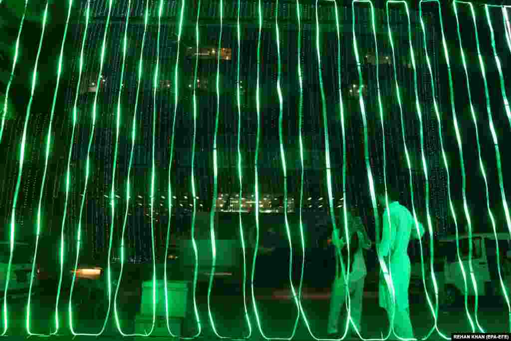 A building is illuminated on the eve of Independence Day celebrations in Karachi, Pakistan, on August 13. (epa-EFE/Rehan Khan)