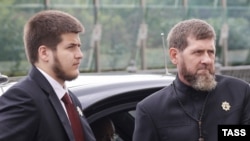 Chechnya's Kremlin-backed leader, Ramzan Kadyrov (right), and his 18-year-old son, Adam, are pictured in Moscow in August 2025.