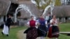 Women run as men throw water at them as part of traditional Easter celebrations, during a media presentation in Szenna, Hungary. (Reuters/Laszlo Balogh)