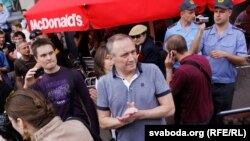 Uladzimer Nyaklyaeu takes part in a "flash mob" protest in Minsk on June 15.