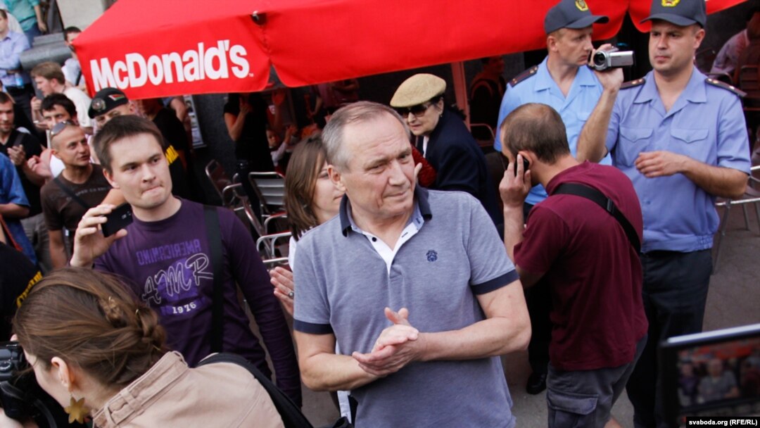 Uladzimer Nyaklyaeu takes part in a "flash mob" protest in Minsk on June 15.