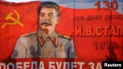 A poster with a portrait of Soviet dictator Josef Stalin is seen during a May Day rally in Volgograd. (file photo)
