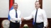 Russia/Armenia - Russian Prime Minister Dmitry Medvedev (R) welcomes his visiting Armenian counterpart Hovik Abrahamian in Sochi,11Jul2014