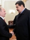 Russian President Vladimir Putin (left) welcomes Venezuela's Nicolas Maduro at Putin's Novo-Ogaryovo residence outside Moscow in 2015.