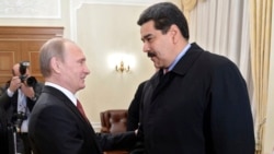 Russian President Vladimir Putin (left) welcomes Venezuela's Nicolas Maduro at Putin's Novo-Ogaryovo residence outside Moscow in 2015.