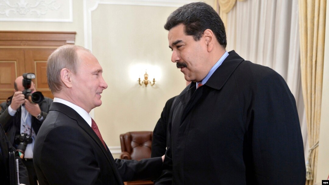 Russian President Vladimir Putin (left) welcomes Venezuelan President Nicolas Maduro during their meeting in Moscow on January 15