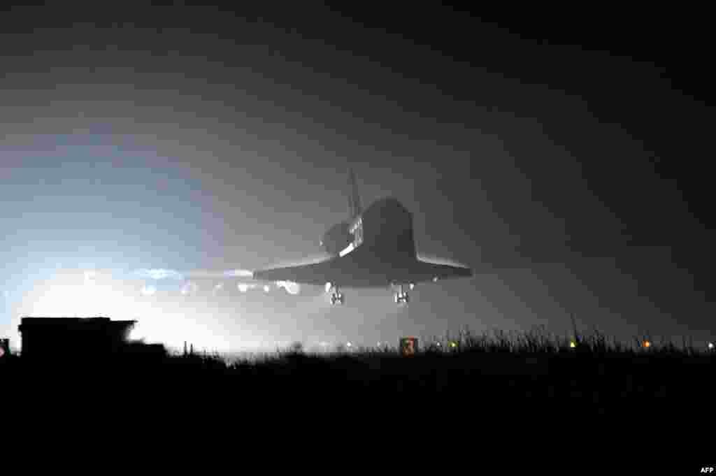 U.S. space shuttle Endeavour lands at the Kennedy Space Center in Florida after completing its final mission on June 1.Photo by Bruce Weaver for AFP. 