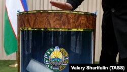 A man casts his ballot at a polling station during the Uzbek presidential election in Tashkent in December 2016.