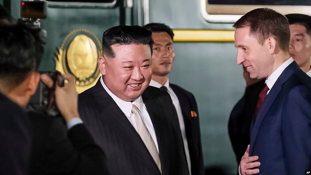 North Korean leader Kim Jong Un (center) is greeted by Russia's Natural Resources Minister Aleksandr Kozlov (right) after Kim crossed the border into Russia for a visit in September.