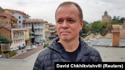 Ivan Pavlov poses for a picture during an interview in Tbilisi on September 9.