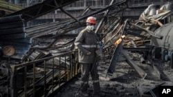 A worker clears the rubble at a Ukrainian power plant hit by a Russian missile earlier this year. Russia has carried out more than 1,000 strikes on Ukrainian energy infrastructure facilities since October 2022.