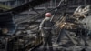 A worker clears the rubble at a power plant damaged in a Russian air strike in Ukraine in April. 