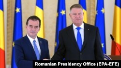 Președinteșle României, Klau Iohannis și liderul PNL, Ludovic Orban, desemnat să conducă noul guvern, București, 15 octombrie 2019