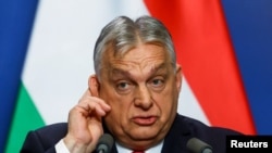 Premierul ungar Viktor Orban, la o conferință de presă pentru media internațională, la Budapesta, pe 5 ianuarie. El a spus recent că niciun parlament ungar nu va fi gata să ratifice aderarea Ucrainei la UE „nici într-o sută de ani”.