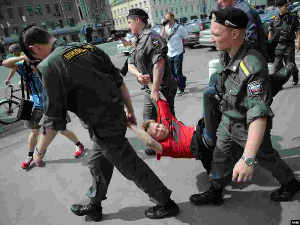 Police detain a Khodorkovsky supporter during a gathering in central Moscow in June 2011.