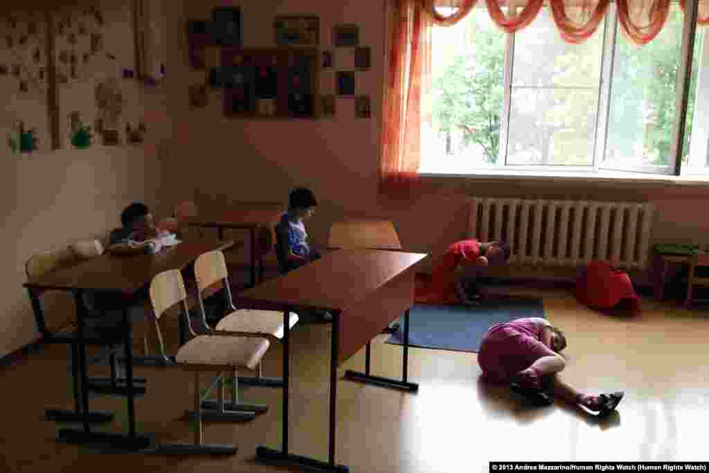 A group of girls, ages 10 to 15, in an orphanage for children with disabilities in northwest Russia.