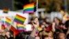 KOSOVO -- A participant vawe rainbow flags during Kosovo's first-ever LGBT pride parade held in Pristina, October 10, 2017