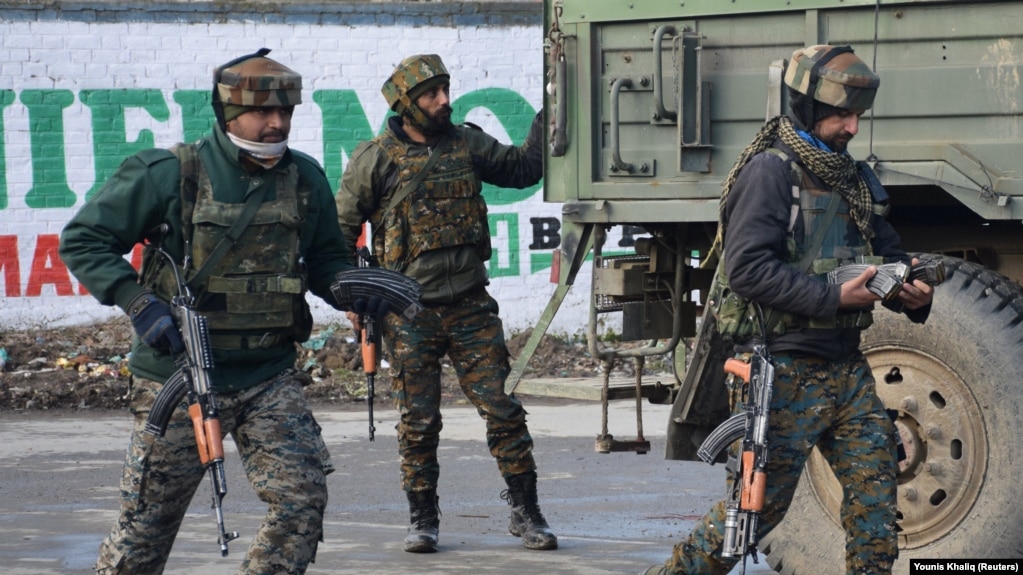 Indian Army soldiers arrive near the site of a gunbattle between suspected militants and Indian security forces in Kashmir's Pulwama district on February 18.