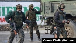 Indian Army soldiers arrive near the site of a gunbattle between suspected militants and Indian security forces in Kashmir's Pulwama district on February 18.