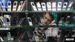 A mobile phone repairman in Tehran. Iran. File photo