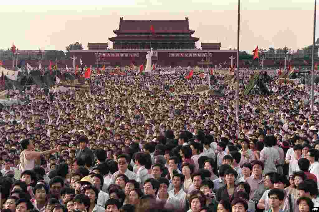 Demonstrators gather around a replica of the Statue of Liberty (back center) on June 2, defying the declaration of martial law and orders to leave the square.