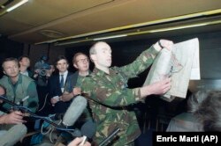 Dutch UN spokesman Major Rob Annink shows a map to journalists at the Holiday Inn in April 1994. He's pointing out the position where a British Sea Harrier jet was shot down over the besieged Bosnian enclave of Gorazde.