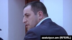 Armenia - Mihran Keshishian, police officer, allegedly assaulted by opposition activist Samson Khachatrian, attends his trial, 19Apr2011.