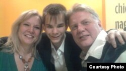 Russian teenager Maksim Kargapoltsev (center) with Mil (right) and Diana Wallen, the U.S. couple who want to adopt him.