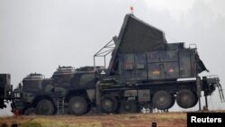 German military vehicles carrying equipment for NATO Patriot missiles are deployed at a military base in Kahramanmaras, Turkey, in January 2013.