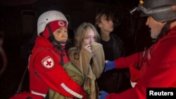 A young woman reacts after her mother was killed during a Russia drone strike on Kharkiv in northeastern Ukraine on November 23. 