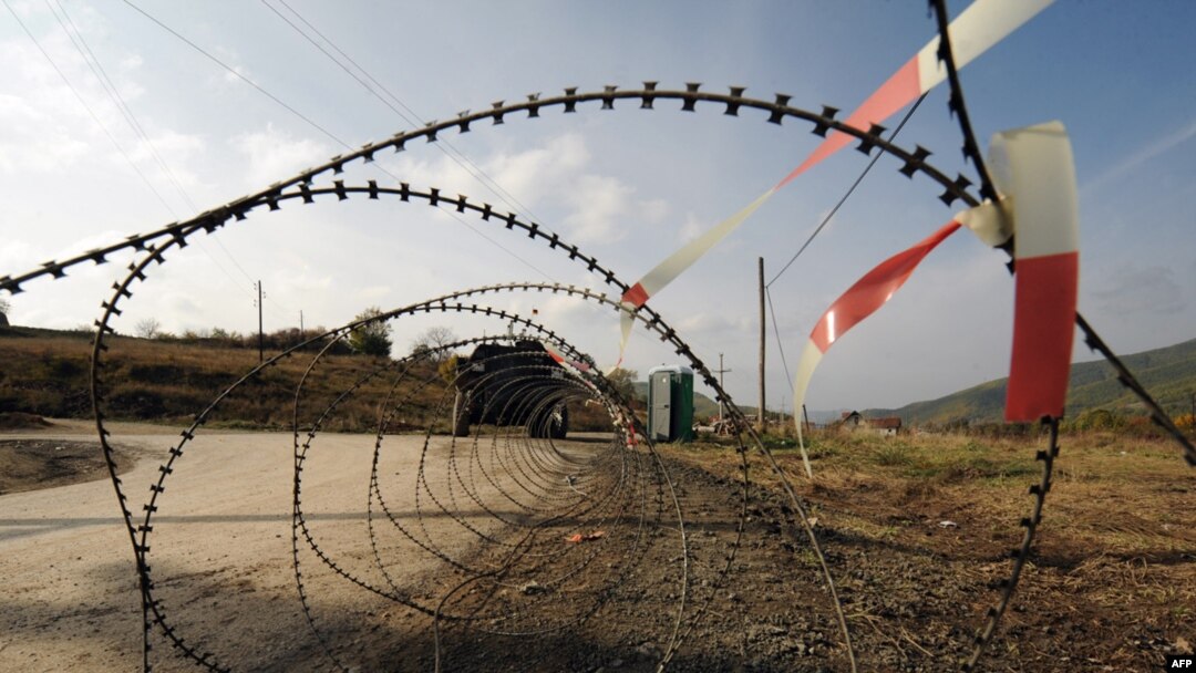 German KFOR troops patrol near a Serb-erected barricade in the village of Zupce, northern Kosovo.