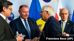 EU foreign policy chief Josep Borrell (second right), talks to Ukrainian Foreign Minister Dmytro Kuleba (left), Moldovan Foreign Minister Aureliu Ciocoi (second left) and Georgian Foreign Minister Davit Zalkaliani after a meeting in Brussels on June 24. 