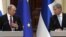 Russian President Vladimir Putin (left) and Finnish President Sauli Niinisto hold a joint news conference in the Presidental Palace in Helsinki on August 21.