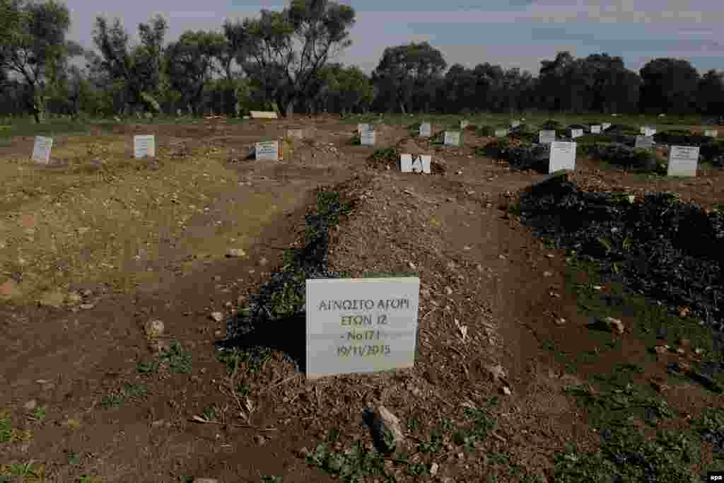 The grave of an unidentified 12-year-old boy who drowned as he was trying to cross the channel between the Turkish coastline and the Greek island of Lesbos, at a cemetery for refugees or migrants, near the original cemetery of Kato Tritos, on Lesbos Island, Greece. (epa/Orestis Panagiotou)