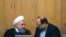 President Hassan Rouhani (left) is speaking with minister of industry, Mohammad Shariatmadari, in the cabinet session, June 27, 2018.