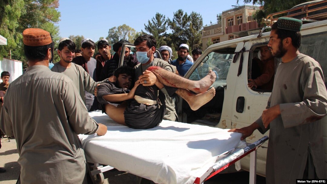 An Afghan man who was injured in a bomb blast is shifted to a hospital in Lashkar Gah, the capital of Helmand Province.